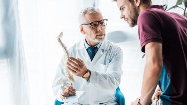 Doctor discussing spine conditions with patient